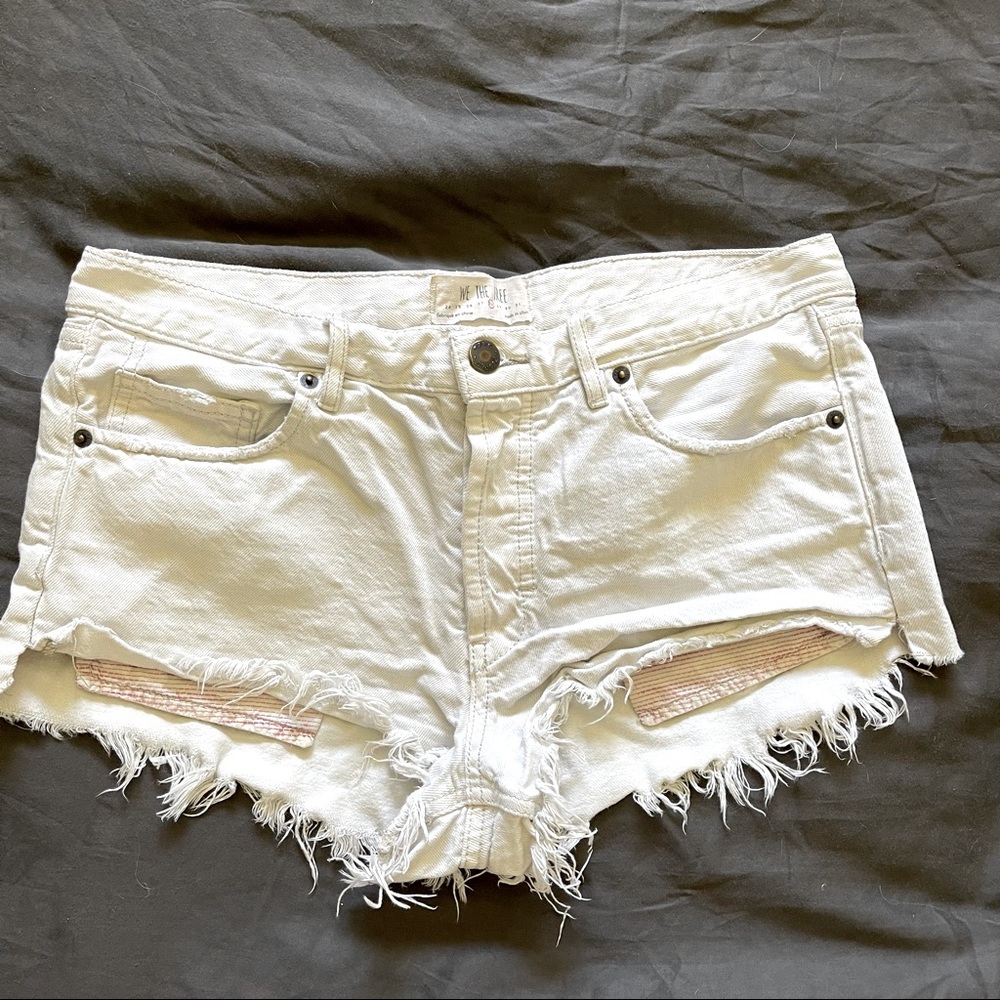 Free people distressed white Jean shorts